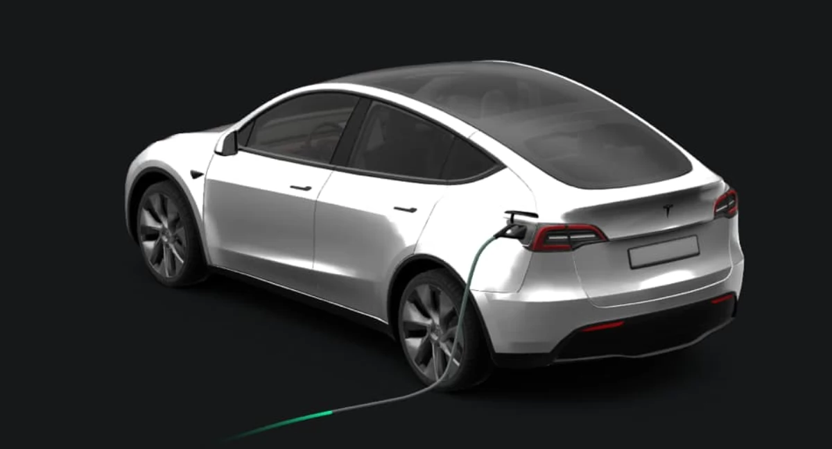 Zdjęcie przedstawia grafikę ładującego się auta elektrycznego