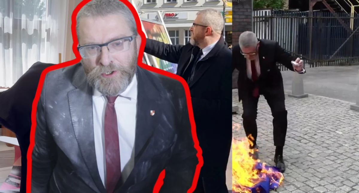 Zdjęcie Grzegorza Brauna podczas niszczenia flagi