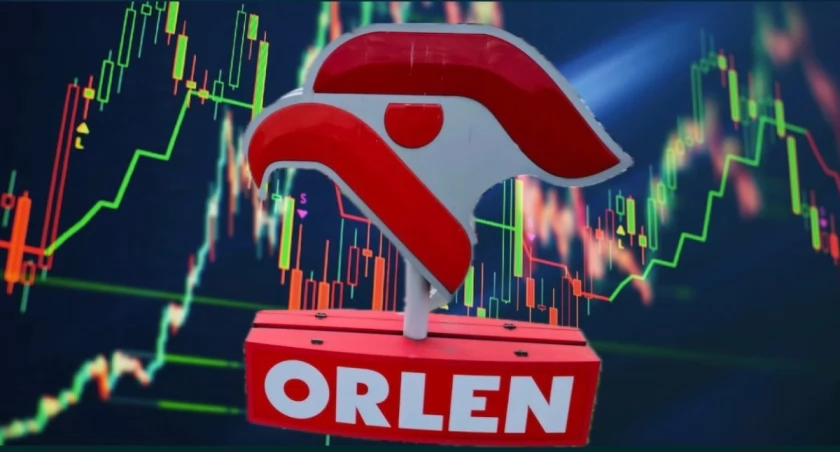 Logo Grupy Orlen na tle stacji paliw – rekordowe wyniki pierwszego kwartału 2026 zysk 8,1 miliarda złotych najwyższa dywidenda w historii 9,3 miliarda złotych